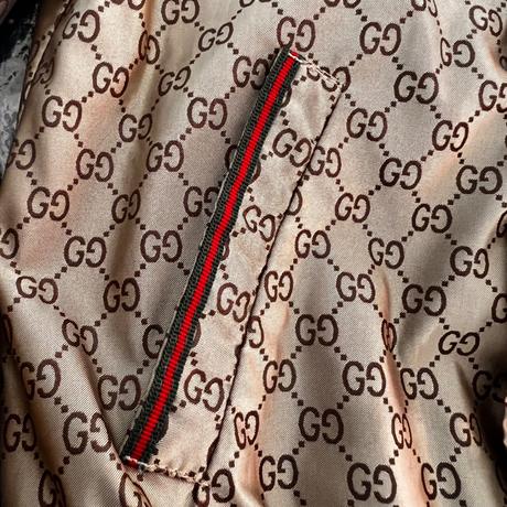 Gucci logo zlatá bunda s volánom a trikolórougucci, 104