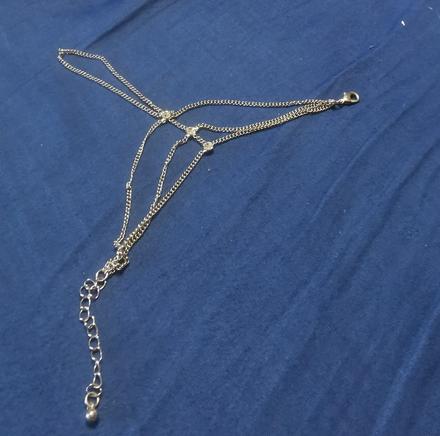 Retiazka na ruku cez prst, 