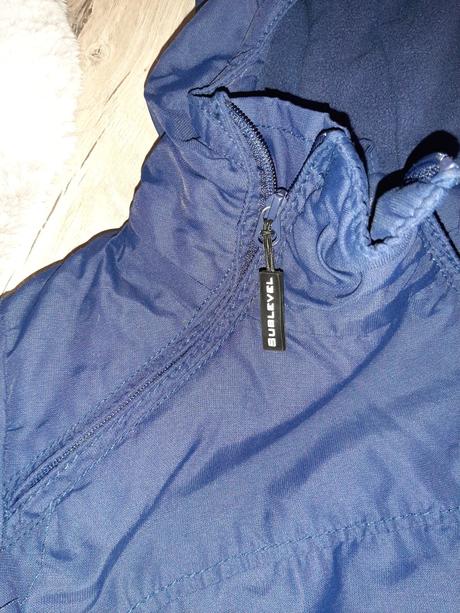 Bunda so šikmím zapínaním sublevel, s