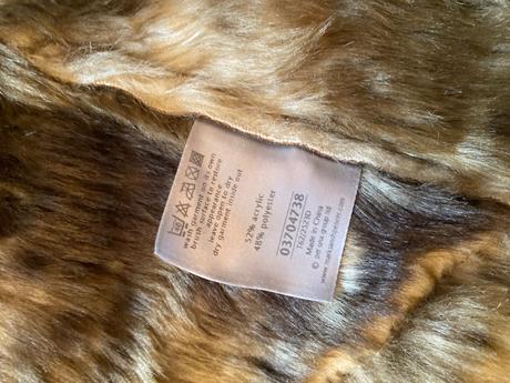 Kozusinova vesta per una, s