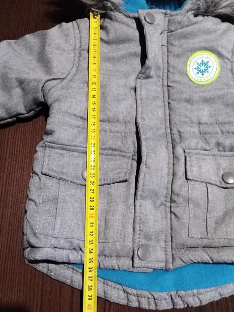 Šedá bundička, 86