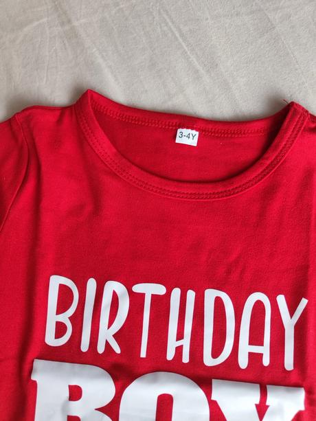 Narodeninové tričko, 98