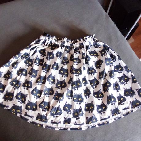 Sukňa s mačkami, 134