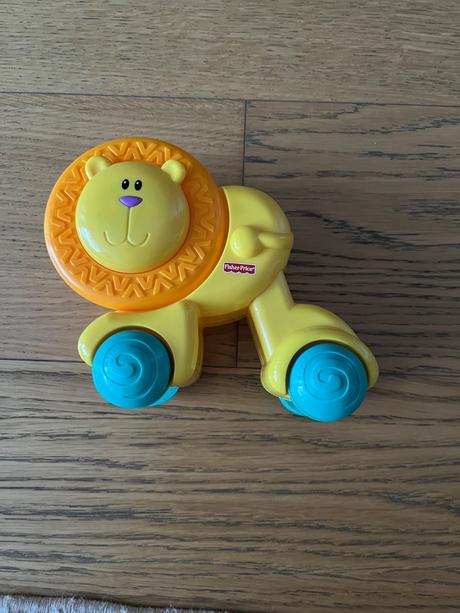 Lev na kolieskach fischer price, 