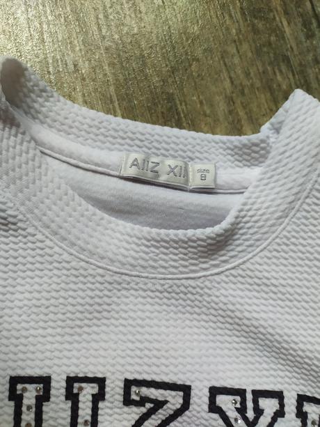 Hrubšie biele triko, 134