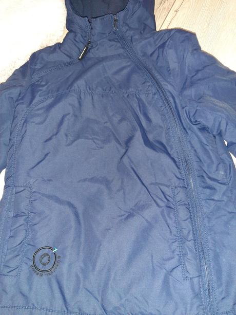 Bunda so šikmím zapínaním sublevel, s