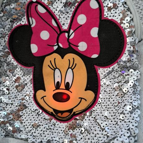 Blikajúci ruksak minie, 